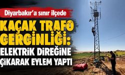Diyarbakır'a sınır ilçede kaçak trafo gerginliği: Elektrik direğine çıkarak eylem yaptı