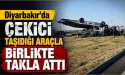 Diyarbakır'da çekici taşıdığı araçla birlikte takla attı