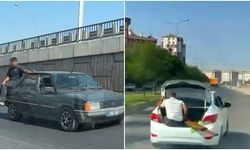 Diyarbakır'da biri bagajda diğeri bagaj kapısında oturup ilerledi