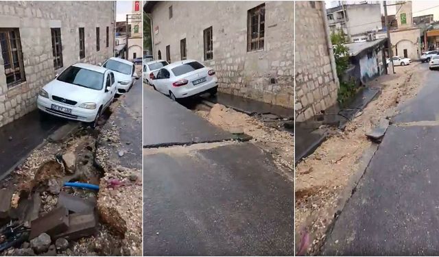 Ergani'de yağış sonrası yol çöktü: Park halındaki araçlar çukura düştü!
